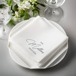 White folded napkins with "The Millers" and "09.09.2026" printed in black.